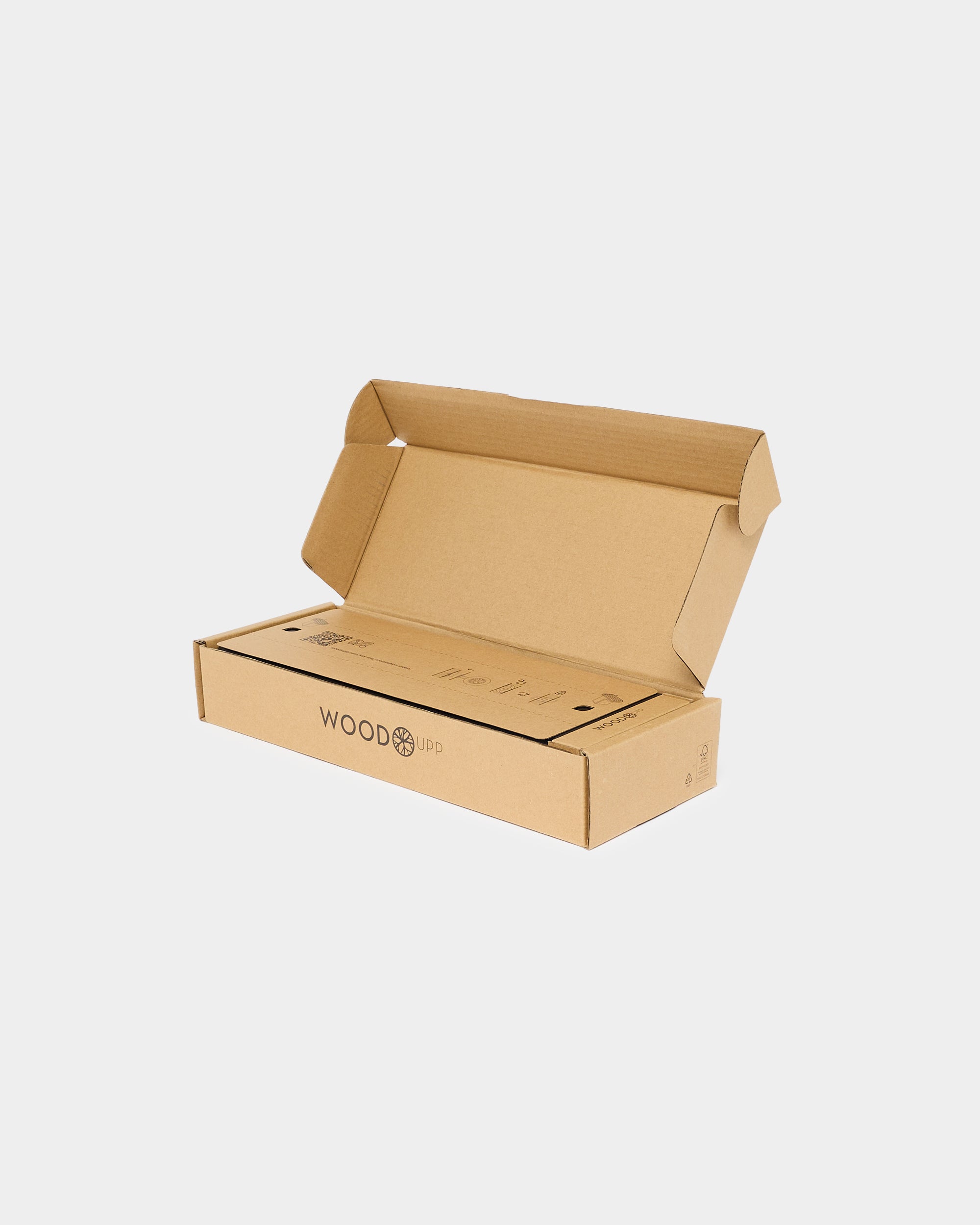 An open, empty brown cardboard box with the WOODUP logo is placed on a minimalist white background.